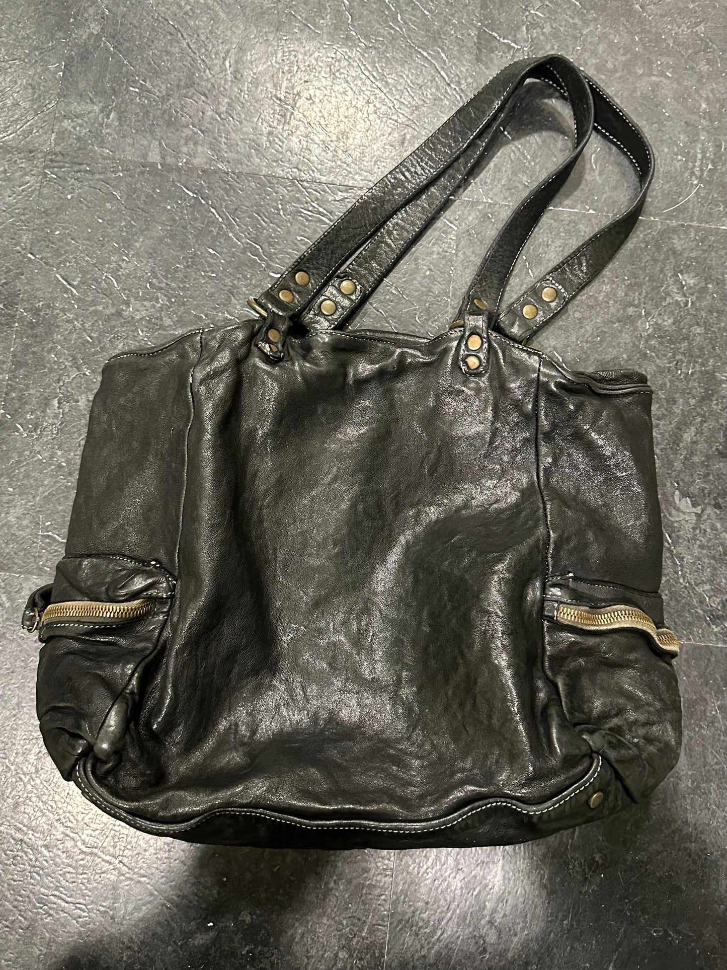 Waved leather bag