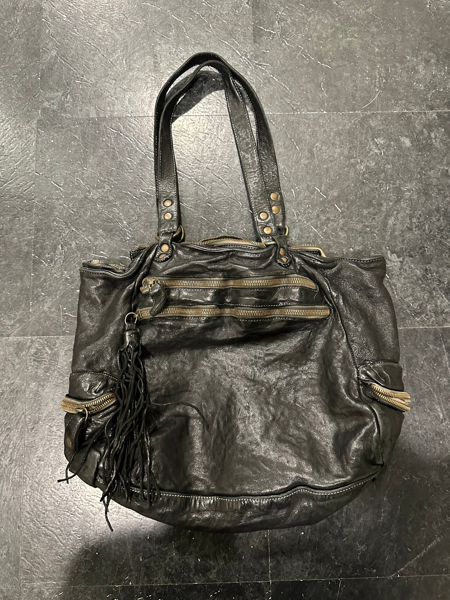 Waved leather bag