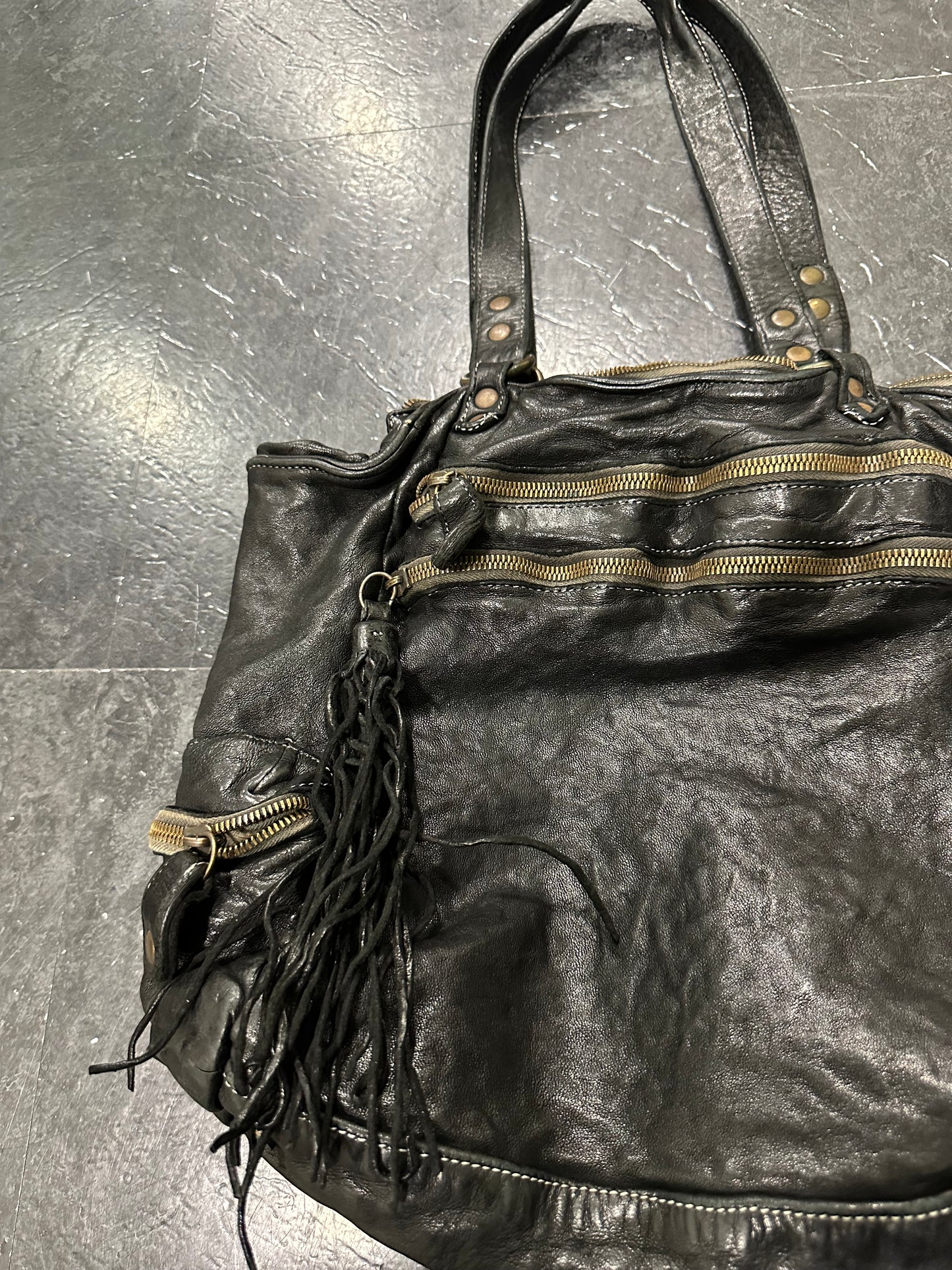 Waved leather bag