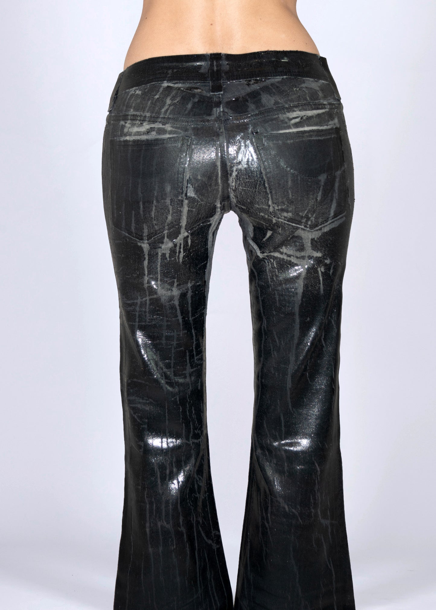 Cracked leather effect jeans
